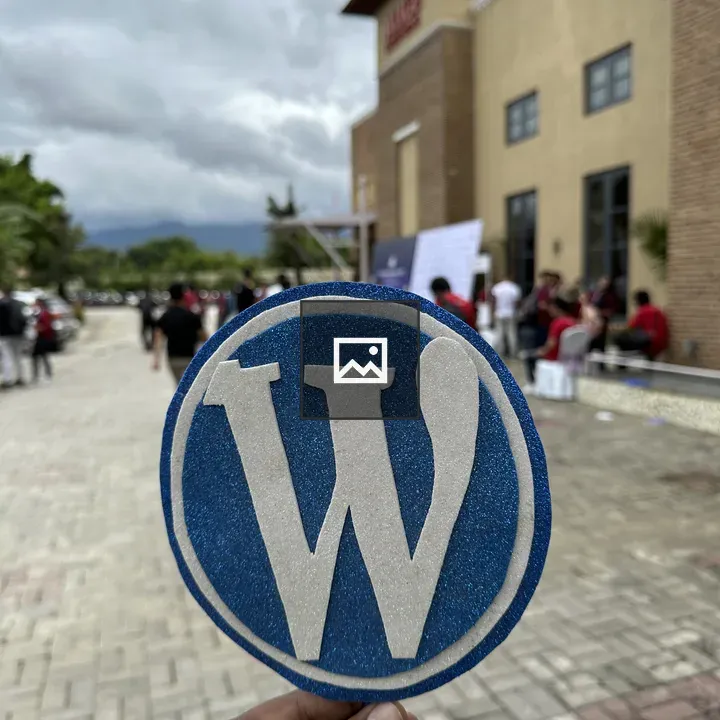Hand Holding WordPress Logo