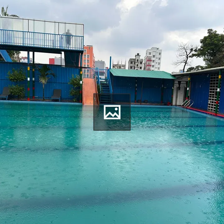Swimming pool under cloudy sky