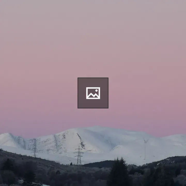 Snowy mountain with wind turbines