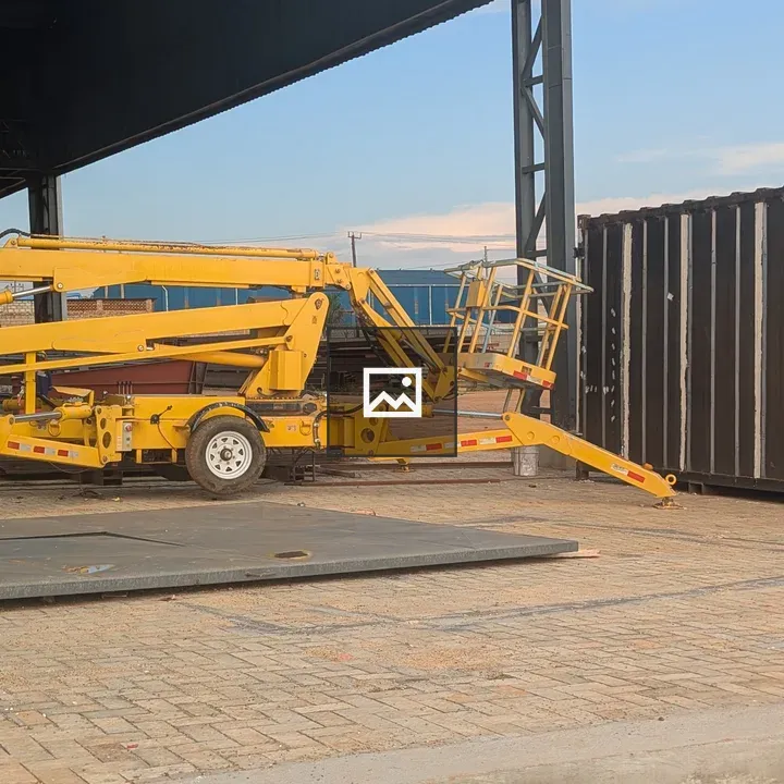 Yellow Hydraulic Lift on Cobblestone