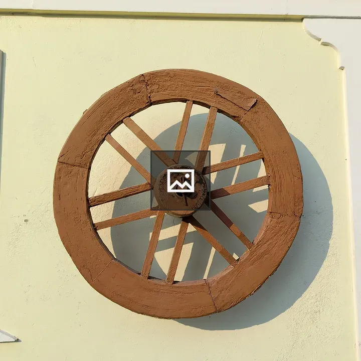 Decorative wooden wheel on wall
