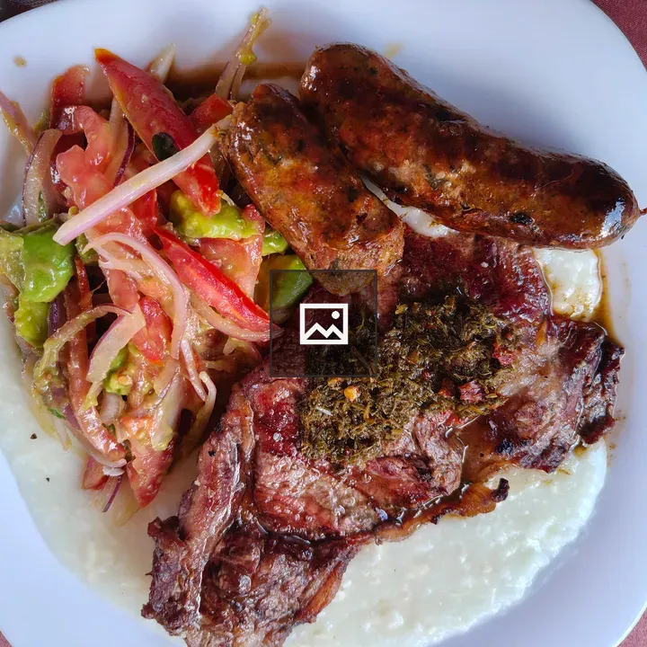 Juicy meat with sausages and salad