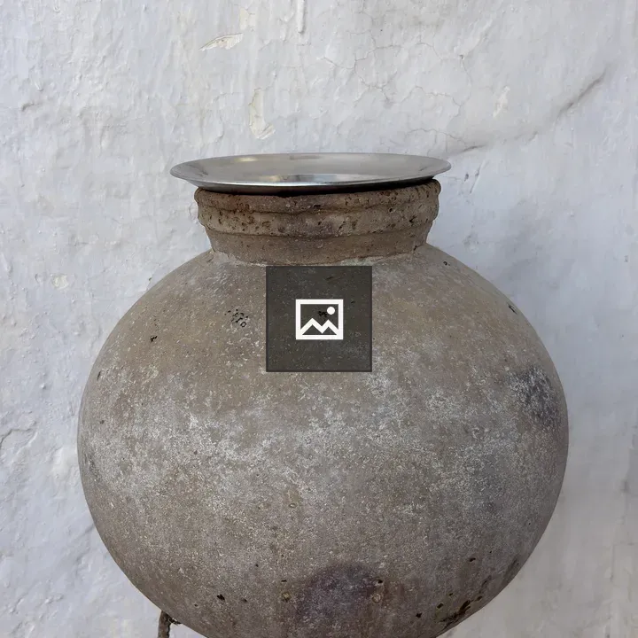 Clay pot on metal stand