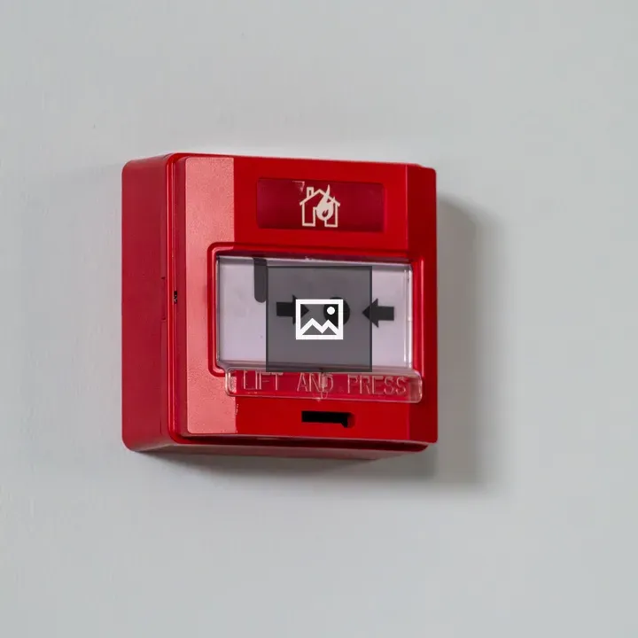 Fire alarm call point on wall