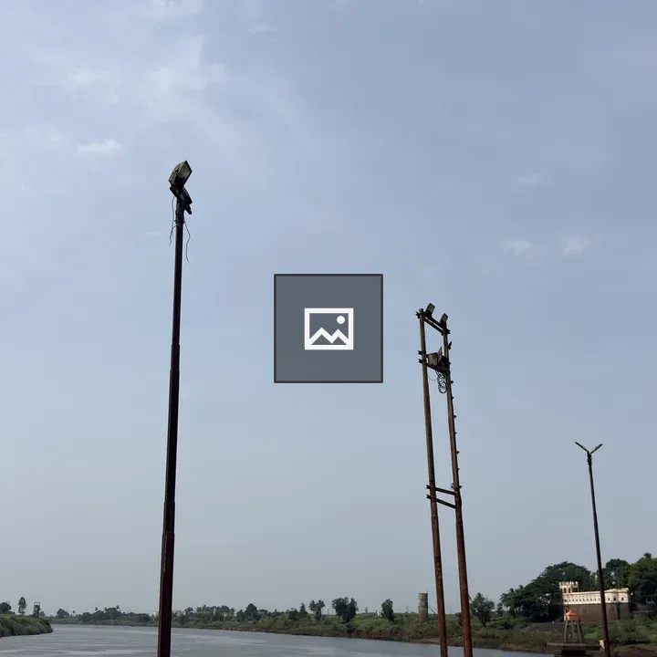 Riverbank with floodlight poles