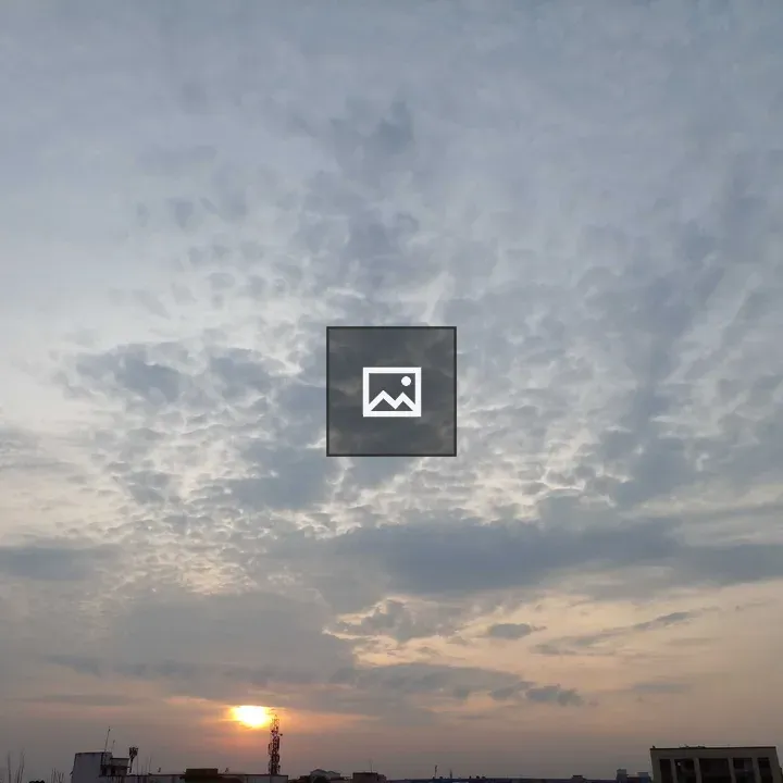 Sunset over gray city silhouettes
