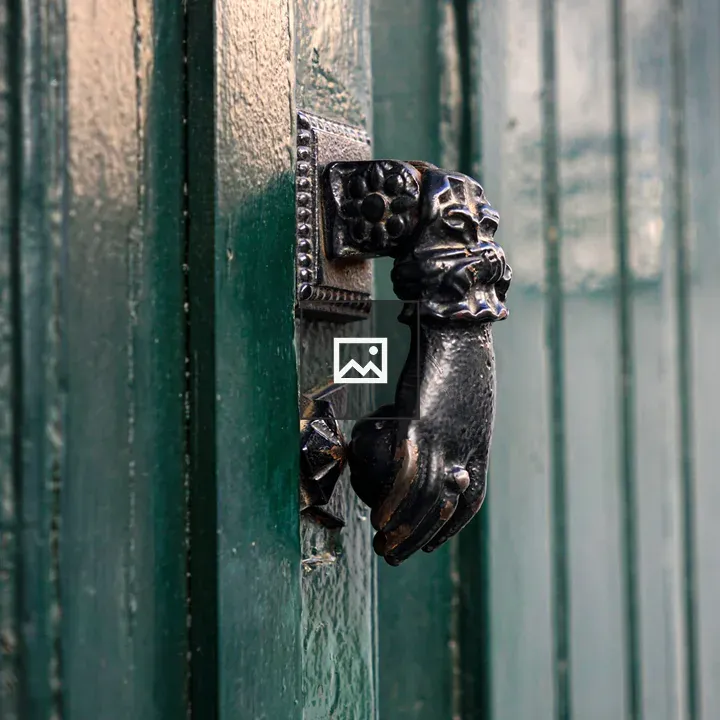 Hand-shaped door knocker