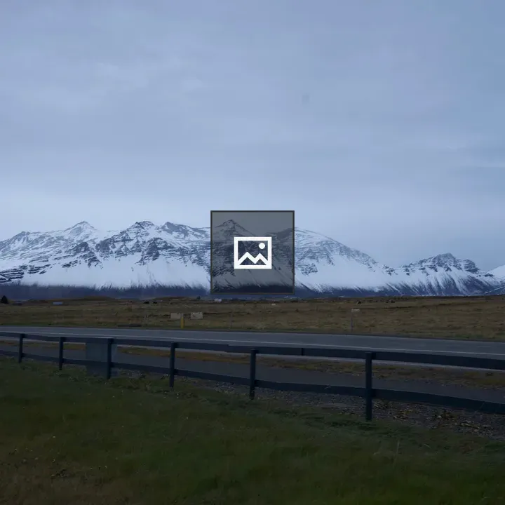 Road in Iceland with Snow Mountains