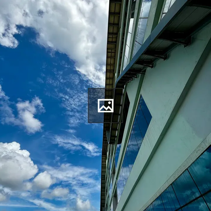 Building Reflects Sky in Windows