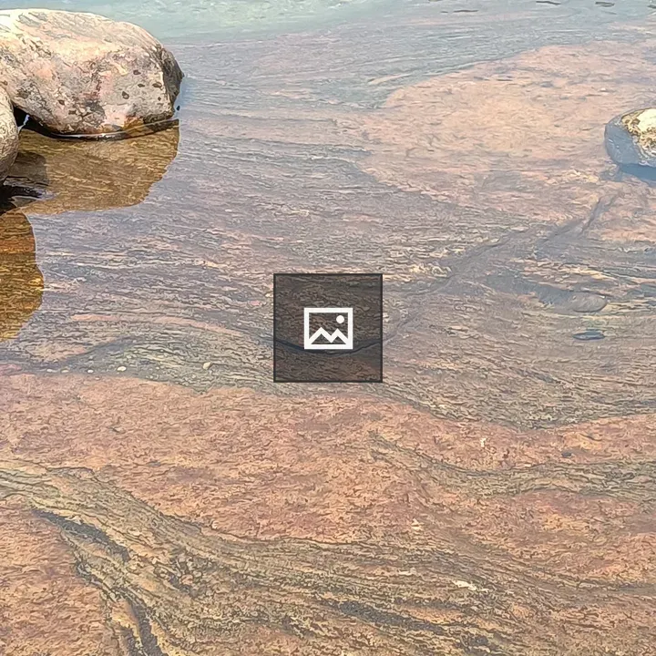 Clear water over rocky lake bed