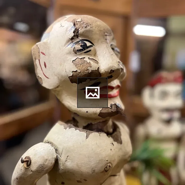 Wooden puppet sculpture