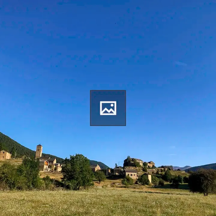 Village against a verdant hillside