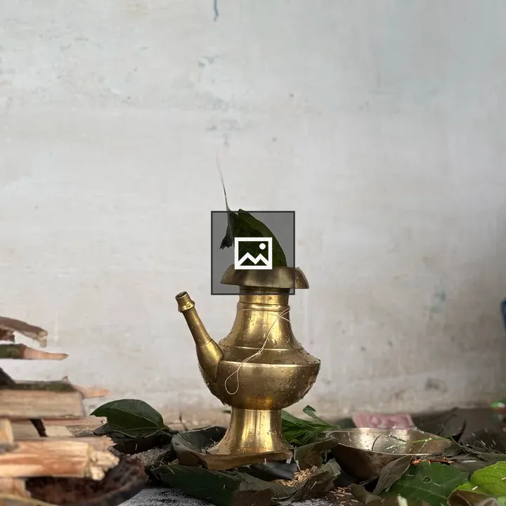 Brass Water Pot on Ground