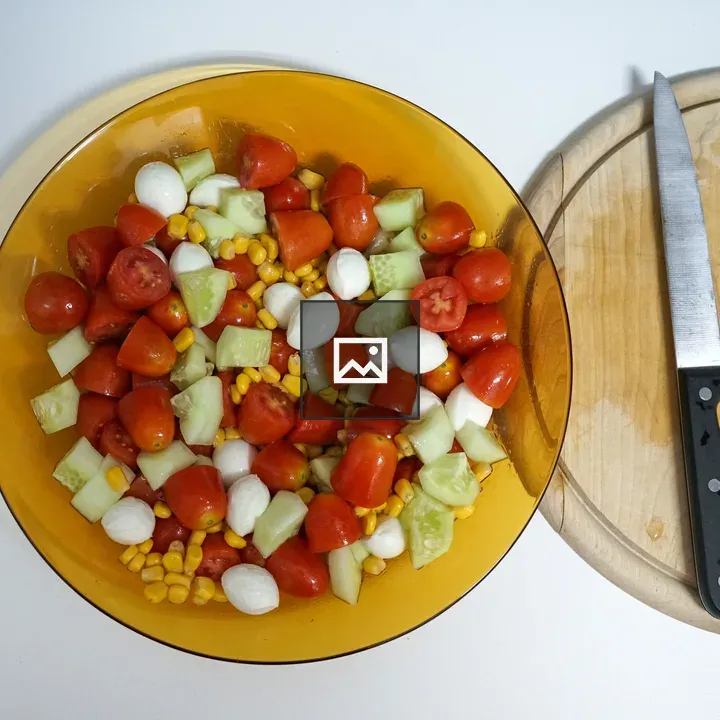 Yellow salad bowl with tomatoes and mozzarella