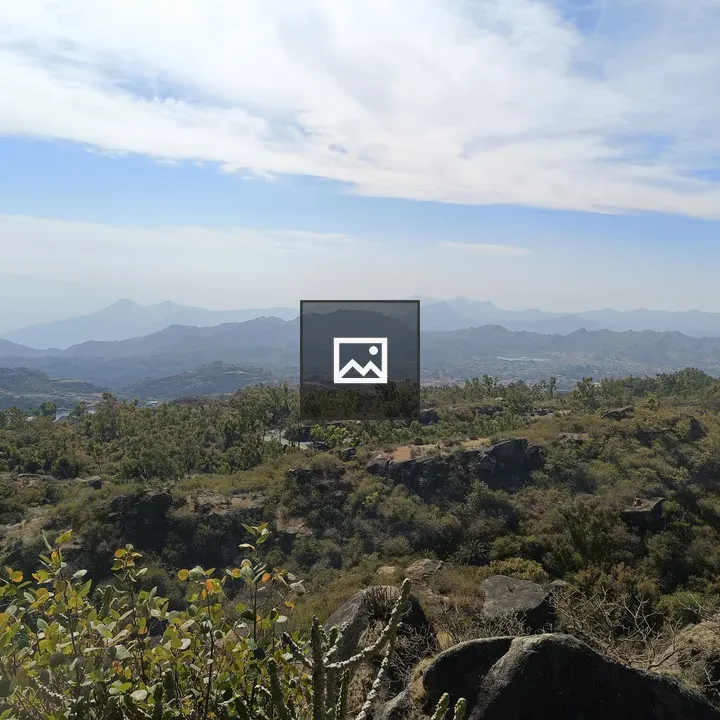 Panoramic hill landscape with blue sky