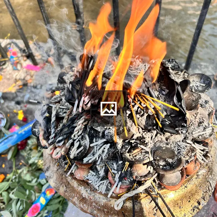Candles Flickering in Temple Surroundings