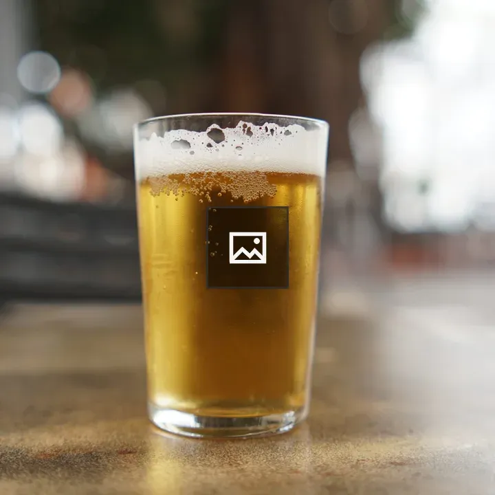 Glass of beer on table