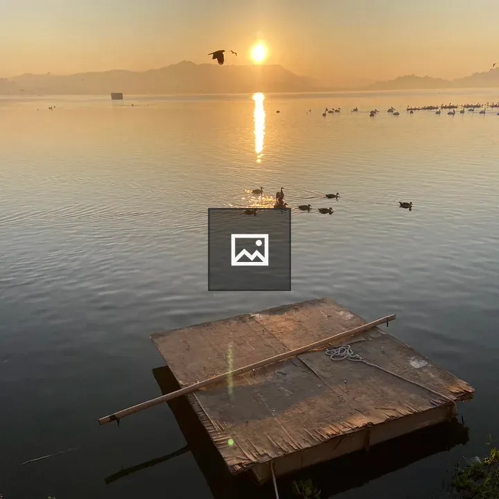 Sunrise over water and sky