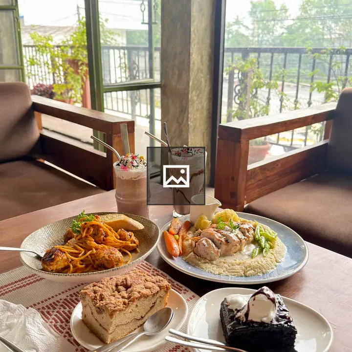 Cozy cafe table with dessert and drinks