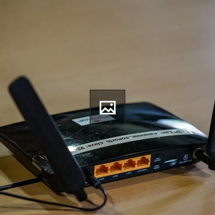 Black wireless router on wood