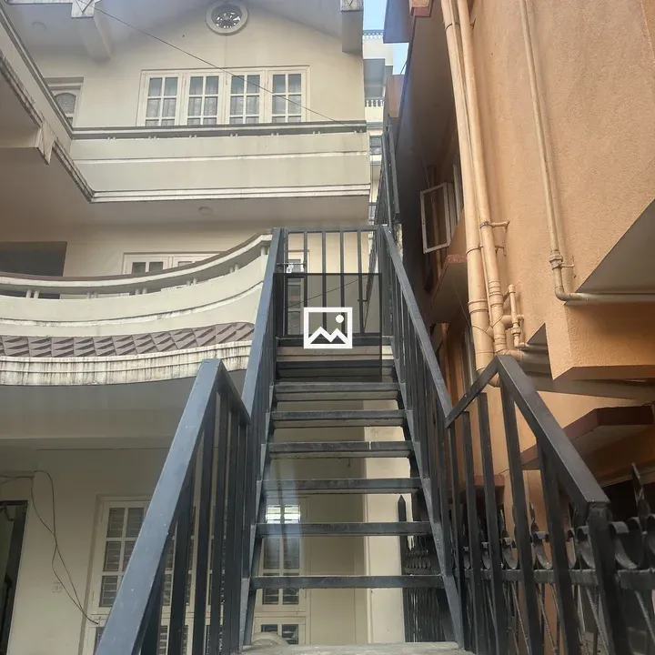 Metal staircase with black railings