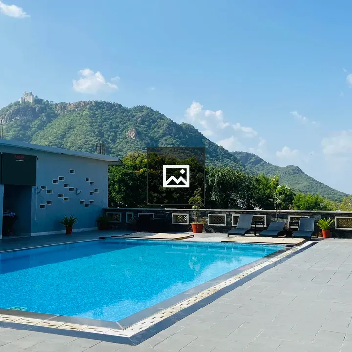 Outdoor Pool with Green Hills
