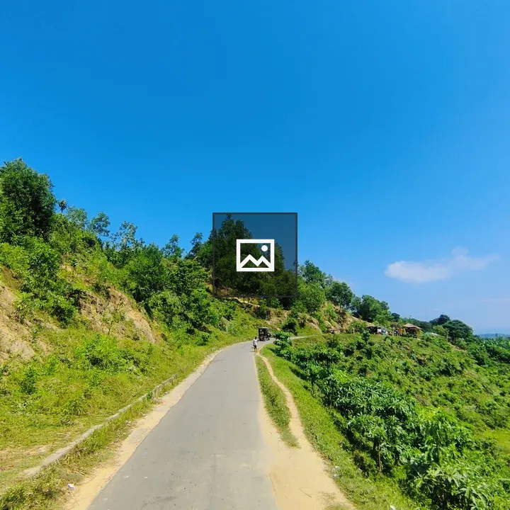 Straight roads between hill and fields