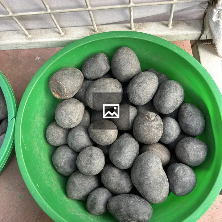 Green bowl with black stones