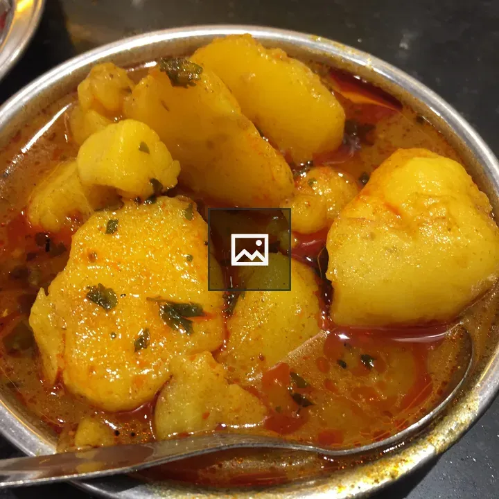 Potato curry in red gravy