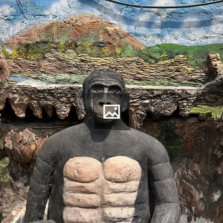 Life-sized chimp sculpture
