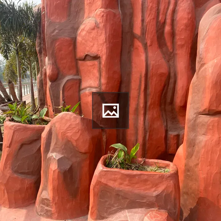 Red rock formation with planters