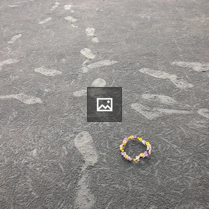 Artificial flower on the sand