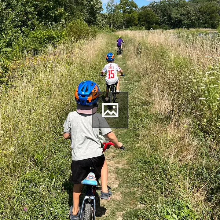 Three kids on bikes