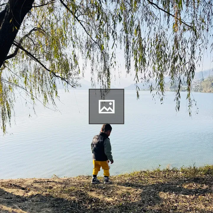 Child Walking by Fewa Lake