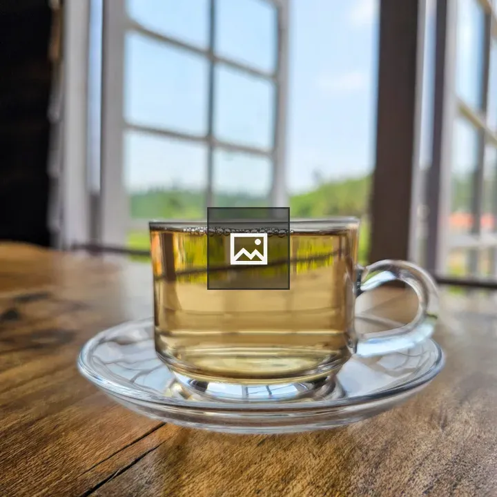 Cup of white tea on wooden table