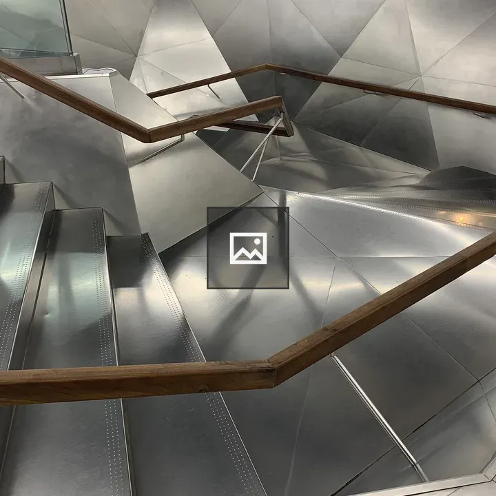Modern Staircase with Curved Wood Handrail