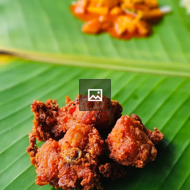 Crispy fried chicken on banana leaf