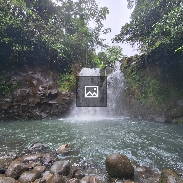 Waterfall Over Rocky Cliffs