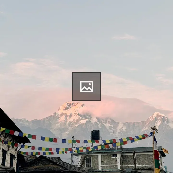 Snowy mountain landscape above rooftops