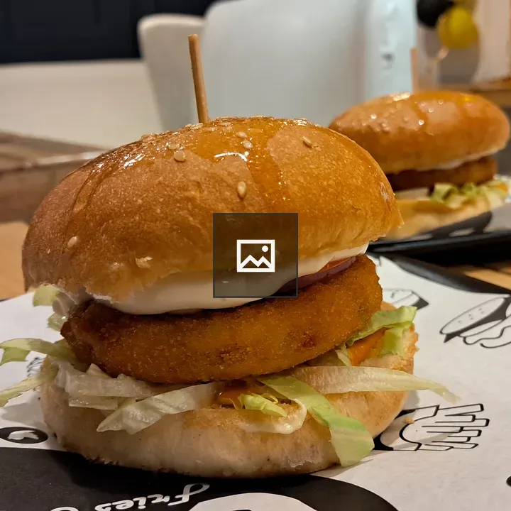 Burger in a bun with lettuce