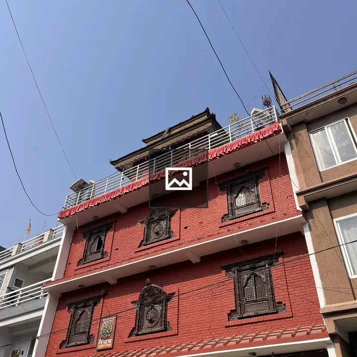 Multi-story Brick Building with Ornate Windows