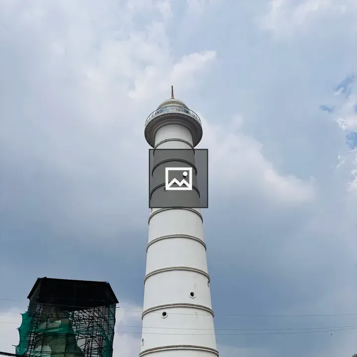Dharahara Tower against cloudy sky