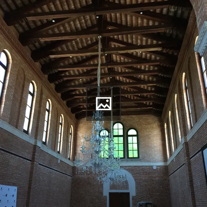 Chandeliers in vaulted brick hall