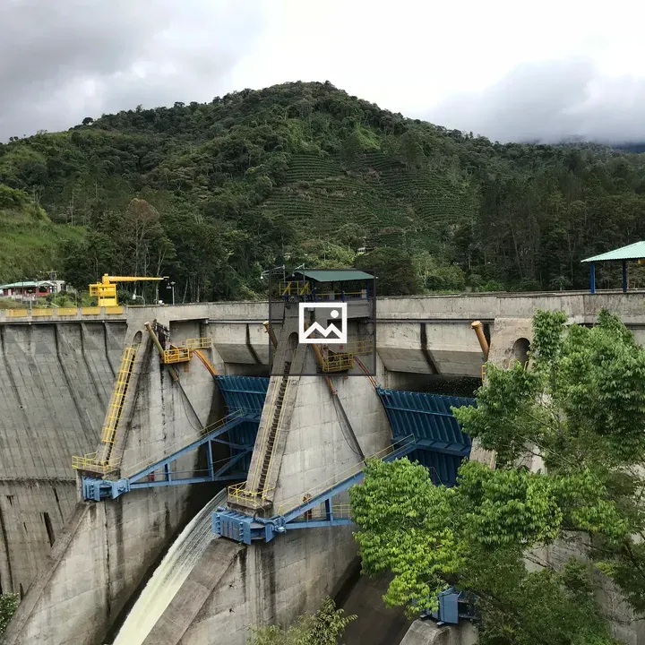 Dam Amid Green Mountains