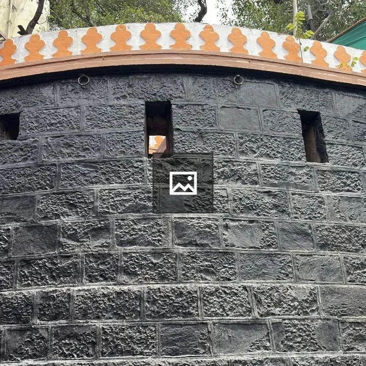 Textured black stone wall