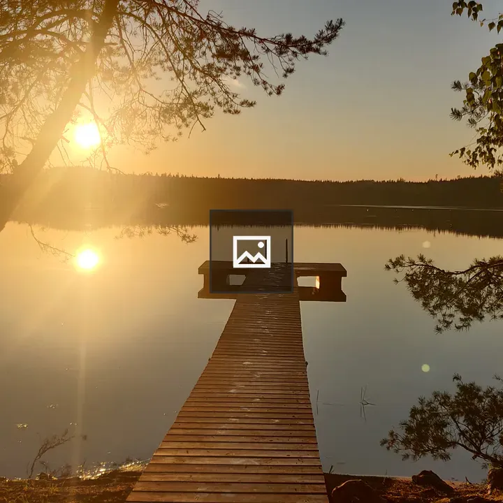 Sunset over lake with pier