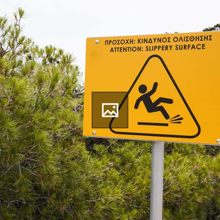 Warning sign by trees