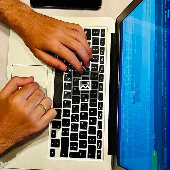 Typing on a Laptop with Phone Nearby