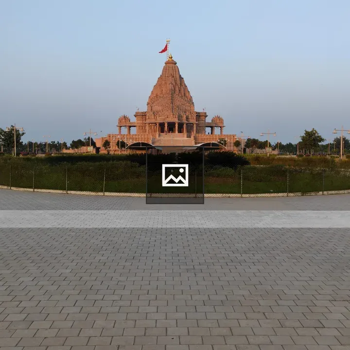 Temple with golden dome and tile walkway