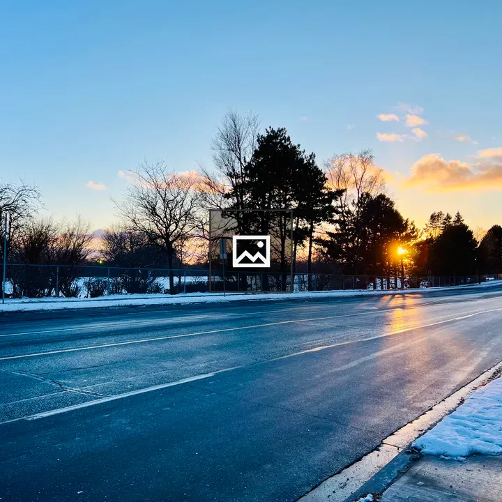 Snowy Road Sunset